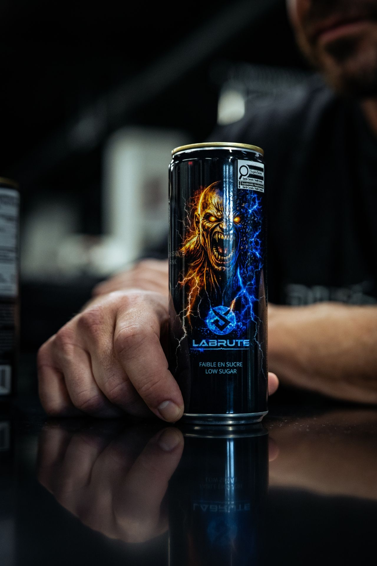 Labrute X OnOff low sugar energy drink can in a fitness gym