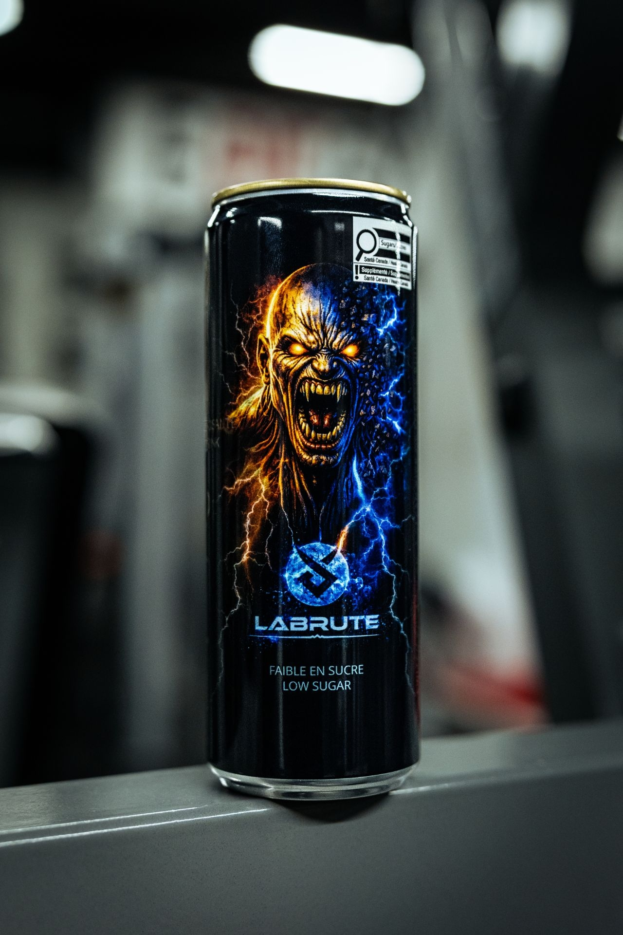 Labrute X OnOff Energy Drink low sugar energy drink can displayed in a bodybuilding gym